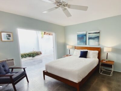 Main bedroom with ensuite bath and view of terrace